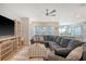 Comfortable living room with large gray sectional sofa, ceiling fan, and open floor plan at 3278 Great Egret Dr, Johns Island, SC 29455