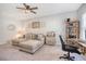 Comfortable living room with a cozy sectional sofa, wooden desk, and neutral decor at 3278 Great Egret Dr, Johns Island, SC 29455