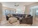 Spacious living room with large sectional sofa and access to kitchen and dining area at 3278 Great Egret Dr, Johns Island, SC 29455