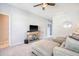 Living room with sectional sofa, ceiling fan and mounted television on a wooden console at 3278 Great Egret Dr, Johns Island, SC 29455