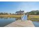 Waterfront pavilion accessible by gangway, showcasing an open-air design and community space at 3278 Great Egret Dr, Johns Island, SC 29455
