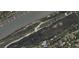 Aerial view of property, highlighting the location near the coastline, a golf course, and other neighborhood homes at 3307 Waterway Blvd, Isle of Palms, SC 29451