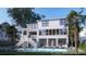 Stunning backyard with a shimmering pool, covered seating, and lush landscaping, designed for ultimate relaxation at 3307 Waterway Blvd, Isle of Palms, SC 29451