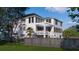 Spacious backyard featuring a pergola-covered deck, lush greenery, and ample space for outdoor activities and relaxation at 3307 Waterway Blvd, Isle of Palms, SC 29451