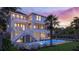 Lush backyard featuring a sparkling pool and hot tub, perfect for relaxing or entertaining guests at 3307 Waterway Blvd, Isle of Palms, SC 29451