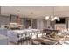 Open-concept kitchen with large island, stainless steel appliances, and a spacious dining area at 3307 Waterway Blvd, Isle of Palms, SC 29451