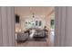 Bright and open living room with fireplace, comfortable seating, and large windows at 3307 Waterway Blvd, Isle of Palms, SC 29451