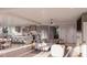 Open-concept kitchen and living area with hardwood floors and modern decor at 3307 Waterway Blvd, Isle of Palms, SC 29451