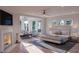 Serene main bedroom with fireplace, sitting area, and ample natural light at 3307 Waterway Blvd, Isle of Palms, SC 29451