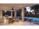 Outdoor patio with a BBQ and poolside lounging furniture, perfect for entertaining or relaxing at 3307 Waterway Blvd, Isle of Palms, SC 29451