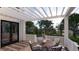 Inviting porch with outdoor dining area featuring comfortable seating, and serene views of the lush landscape at 3307 Waterway Blvd, Isle of Palms, SC 29451