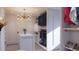 Bright custom closet with island, shelves, and hanging storage at 3307 Waterway Blvd, Isle of Palms, SC 29451