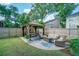 Backyard featuring a gazebo, patio seating, and lush green lawn surrounded by a wooden fence at 332 Clayton Dr, Charleston, SC 29414