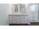 Bright bathroom featuring a double sink vanity with framed mirrors and a glass-enclosed shower at 332 Clayton Dr, Charleston, SC 29414