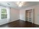 Bedroom with paneling, wood floors, ceiling fan, and closet at 332 Clayton Dr, Charleston, SC 29414
