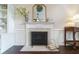 Close-up of the fireplace with marble surround and wooden mantel at 332 Clayton Dr, Charleston, SC 29414
