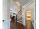 Welcoming foyer with hardwood floors, staircase, and views of the living room and kitchen at 332 Clayton Dr, Charleston, SC 29414