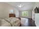 Sunlit main bedroom with vaulted ceiling, hardwood floors, and modern decor at 332 Clayton Dr, Charleston, SC 29414