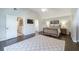 Bright main bedroom featuring hardwood floors, a king-sized bed, and a vaulted ceiling at 332 Clayton Dr, Charleston, SC 29414