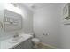 Bright powder room with vanity, modern fixtures, and decorative wall art at 332 Clayton Dr, Charleston, SC 29414