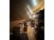 Unfinished attic with sloped ceilings, offering ample storage space with shelving at 351 Duncan Chapel Rd, Harleyville, SC 29448