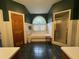 Bathroom boasts a large soaking tub beneath a half round window for natural light, plus separate shower at 351 Duncan Chapel Rd, Harleyville, SC 29448