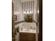 Bathroom with vanity and decorative striped wallpaper at 351 Duncan Chapel Rd, Harleyville, SC 29448