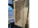 Close up of bathroom featuring a separate stand-up shower, tile floors and trim, and soaking tub at 351 Duncan Chapel Rd, Harleyville, SC 29448