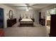 Large bedroom features neutral carpet, ceiling fan, and attached bathroom at 351 Duncan Chapel Rd, Harleyville, SC 29448