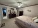 Cozy bedroom features matching dressers and a comfortable bed with floral bedding at 351 Duncan Chapel Rd, Harleyville, SC 29448