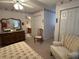 Comfortable bedroom features neutral carpet, chair, and traditional furniture at 351 Duncan Chapel Rd, Harleyville, SC 29448