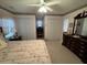 Bedroom featuring floral wallpaper, white trim, and a plush bed at 351 Duncan Chapel Rd, Harleyville, SC 29448