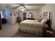 Bedroom features ceiling fan, carpet, and 4 poster bed at 351 Duncan Chapel Rd, Harleyville, SC 29448