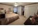 Cozy bedroom with floral bedding, ceiling fan, and ample closet space at 351 Duncan Chapel Rd, Harleyville, SC 29448