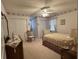 Charming bedroom with a ceiling fan, carpet, and unique wallpaper border detail at 351 Duncan Chapel Rd, Harleyville, SC 29448