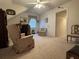 Spacious bonus room with chair, desk, and natural light creates a cozy atmosphere at 351 Duncan Chapel Rd, Harleyville, SC 29448