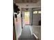 View of the home's entry from the garage with brick stairs and a garage door at 351 Duncan Chapel Rd, Harleyville, SC 29448