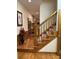 Inviting foyer features hardwood floors and staircase with wood trim at 351 Duncan Chapel Rd, Harleyville, SC 29448