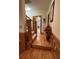 Beautiful entryway with hardwood floors and stairs with wood trim at 351 Duncan Chapel Rd, Harleyville, SC 29448