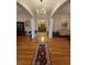 Elegant foyer boasts hardwood floors, a Persian rug, and decorative columns at 351 Duncan Chapel Rd, Harleyville, SC 29448