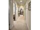 Hallway with neutral carpet leads to bedrooms at 351 Duncan Chapel Rd, Harleyville, SC 29448