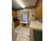 Bright laundry room with washer, dryer, sink, and natural light at 351 Duncan Chapel Rd, Harleyville, SC 29448