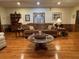 Cozy living room with hardwood floors, decorative lamps, and comfortable furnishings at 351 Duncan Chapel Rd, Harleyville, SC 29448