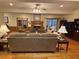 Spacious living room with hardwood floors, a fireplace, and a ceiling fan at 351 Duncan Chapel Rd, Harleyville, SC 29448