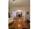 Open-concept living room with hardwood floors, arched doorways, and stylish furnishings at 351 Duncan Chapel Rd, Harleyville, SC 29448