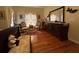 Comfortable bedroom with hardwood floors, chair sitting area, dresser with large mirror, and a lovely decorative rug at 351 Duncan Chapel Rd, Harleyville, SC 29448