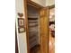 Spacious walk-in pantry with wooden shelves and ample storage space at 351 Duncan Chapel Rd, Harleyville, SC 29448