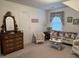 Sitting area features wicker seating and floral decor at 351 Duncan Chapel Rd, Harleyville, SC 29448