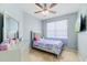 Comfortable bedroom features a ceiling fan and ample natural light at 405 Watershed Dr Dr, Goose Creek, SC 29445