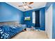 Bright bedroom features a ceiling fan and TV at 405 Watershed Dr Dr, Goose Creek, SC 29445